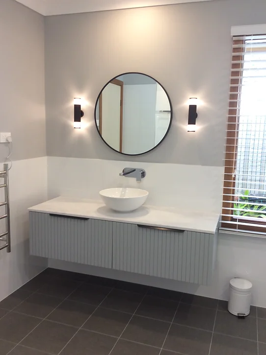 The hallway is a perfect location for a powder room for many reasons.