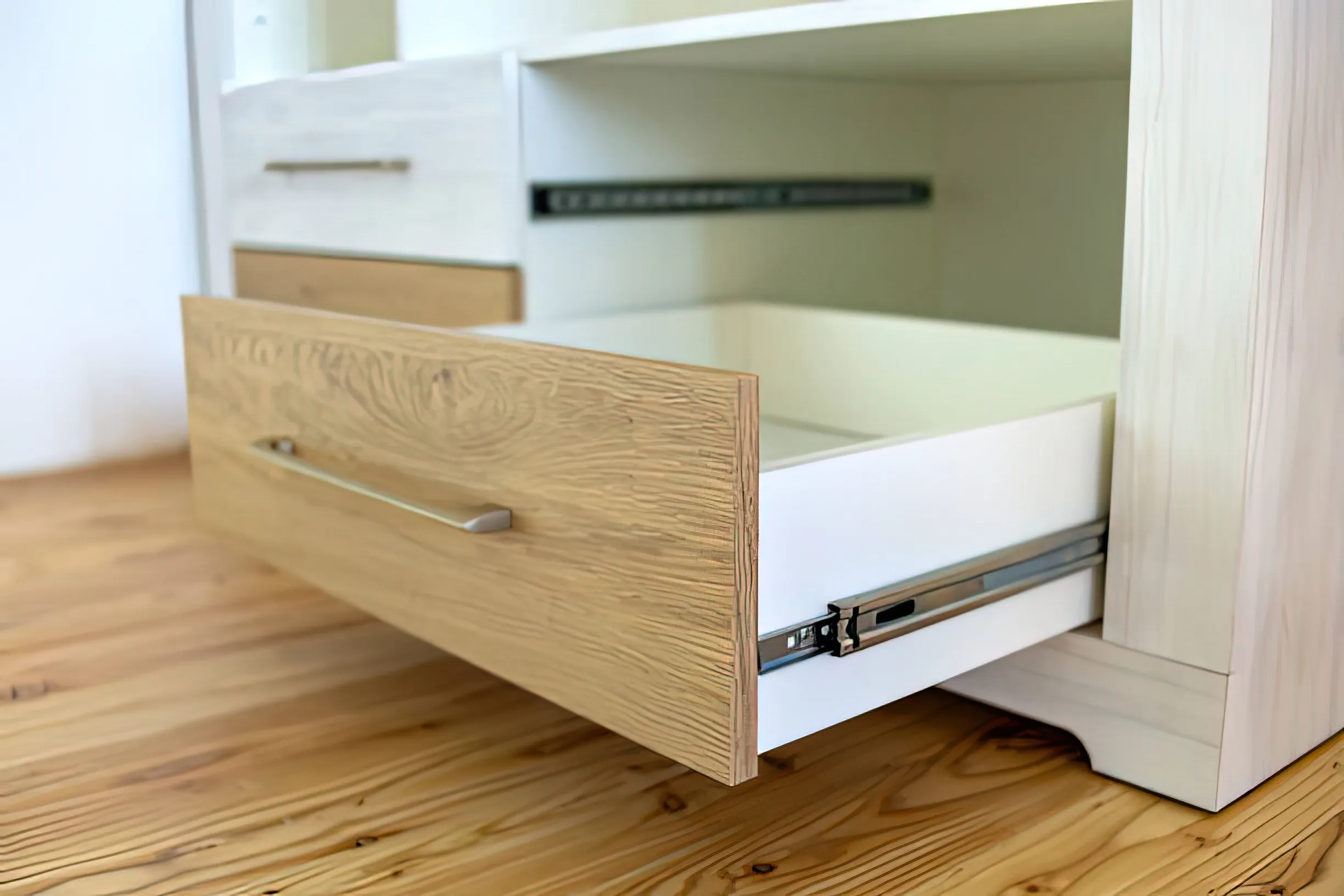 The sides, backs, and bottoms of a well-made drawer should be sturdy wood. 