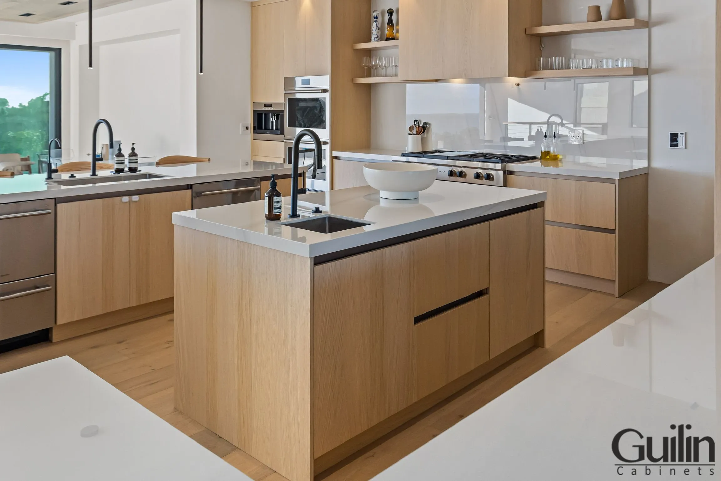 To add this style to your kitchen, one of the easiest ways is to reface your kitchen cabinets. This involves changing out the cabinet doors for something that is sleek, modern, and hands-free.