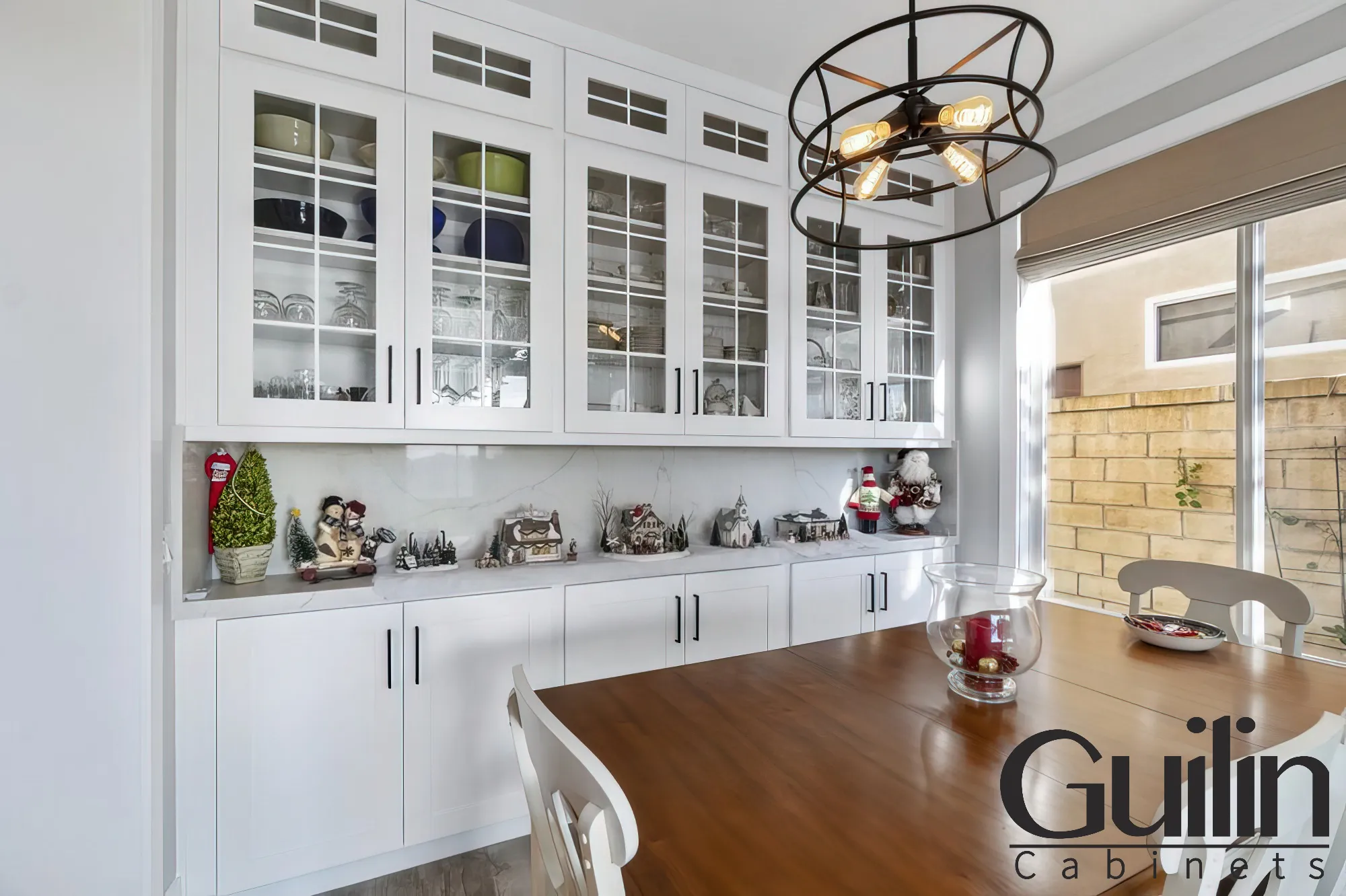 The reflective surface of white cabinets can be used to bounce light around the room