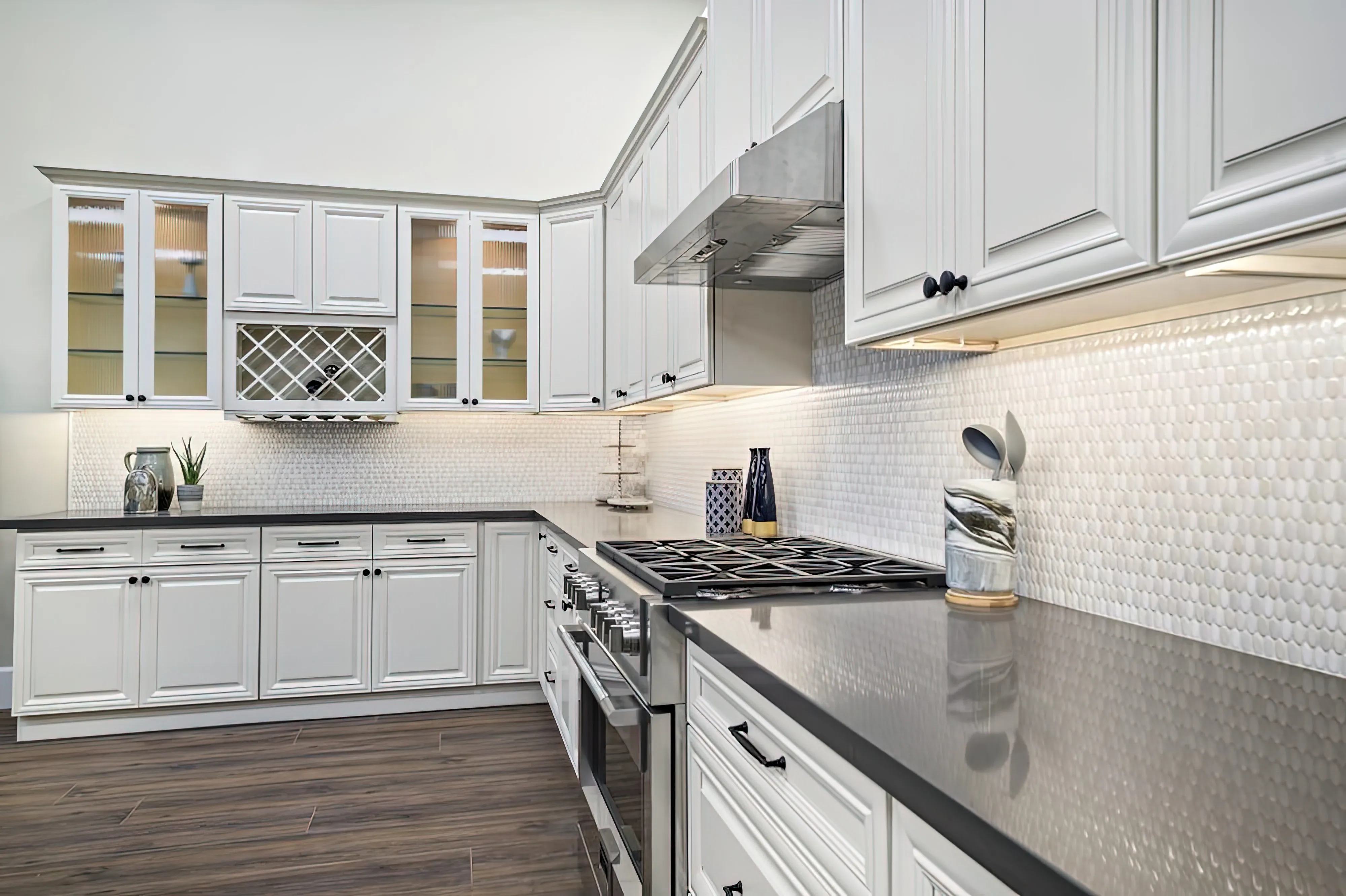 A typically preferred kitchen layout is L-shaped. It features stations on both adjacent walls that run perpendicular to one another. This design works well when there are two people in the kitchen because the workspace is roomy and pleasant 