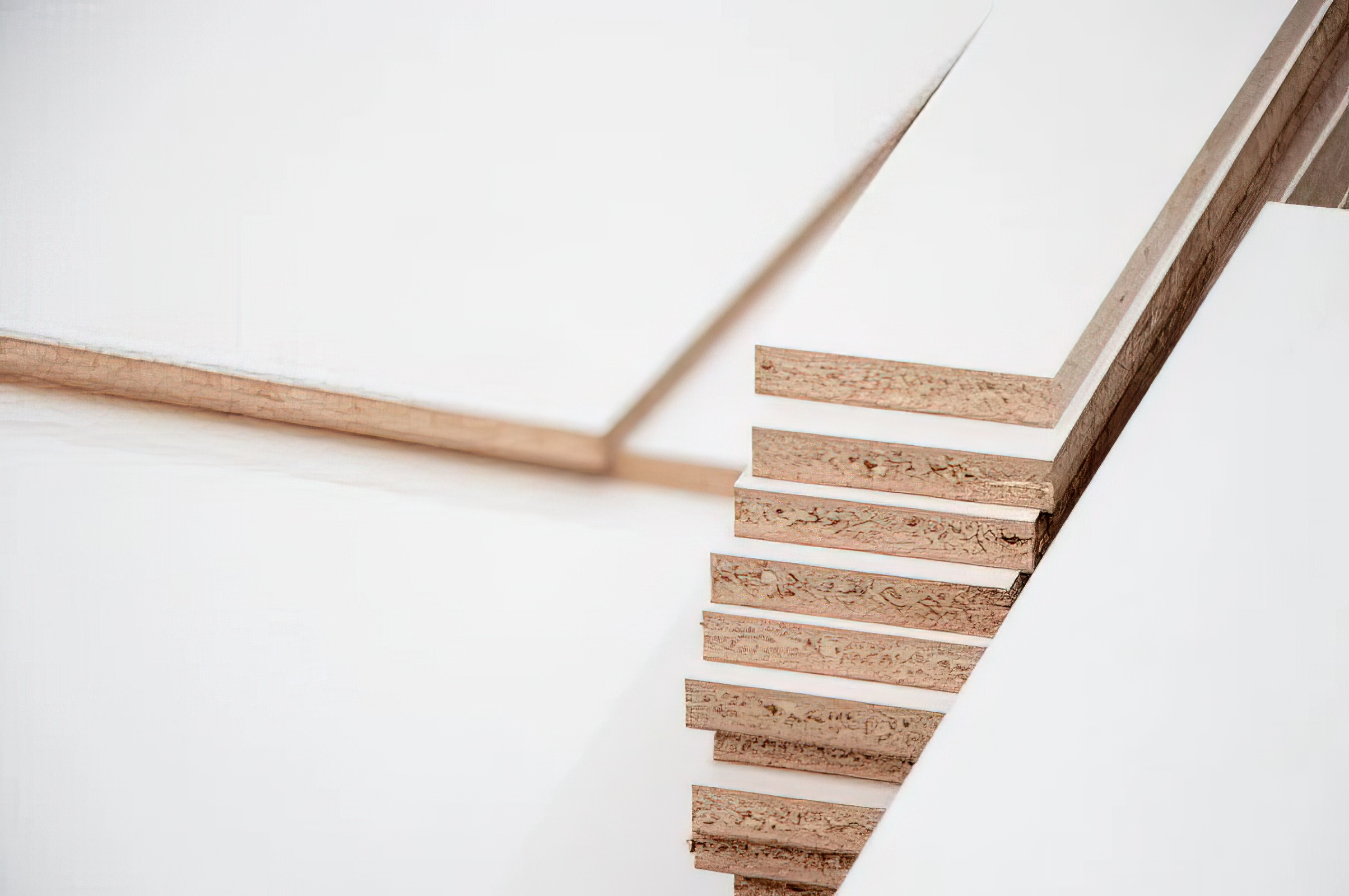sandwiched between two outer thin layers of MDF (medium-density fiberboard).