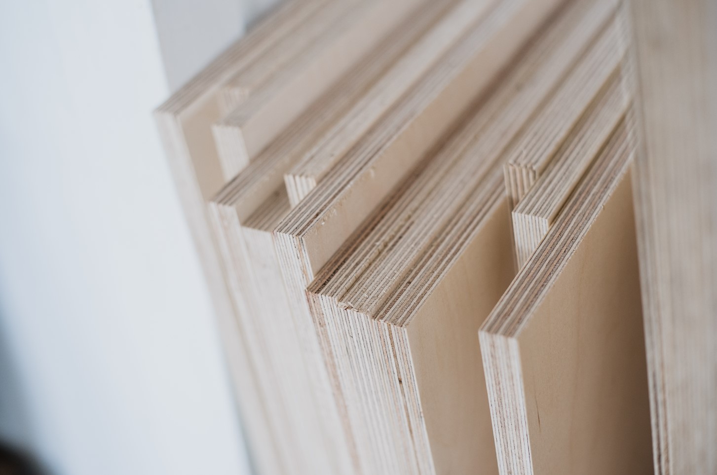 Plywood cabinets are made from thin layers of wood pressed together with glue