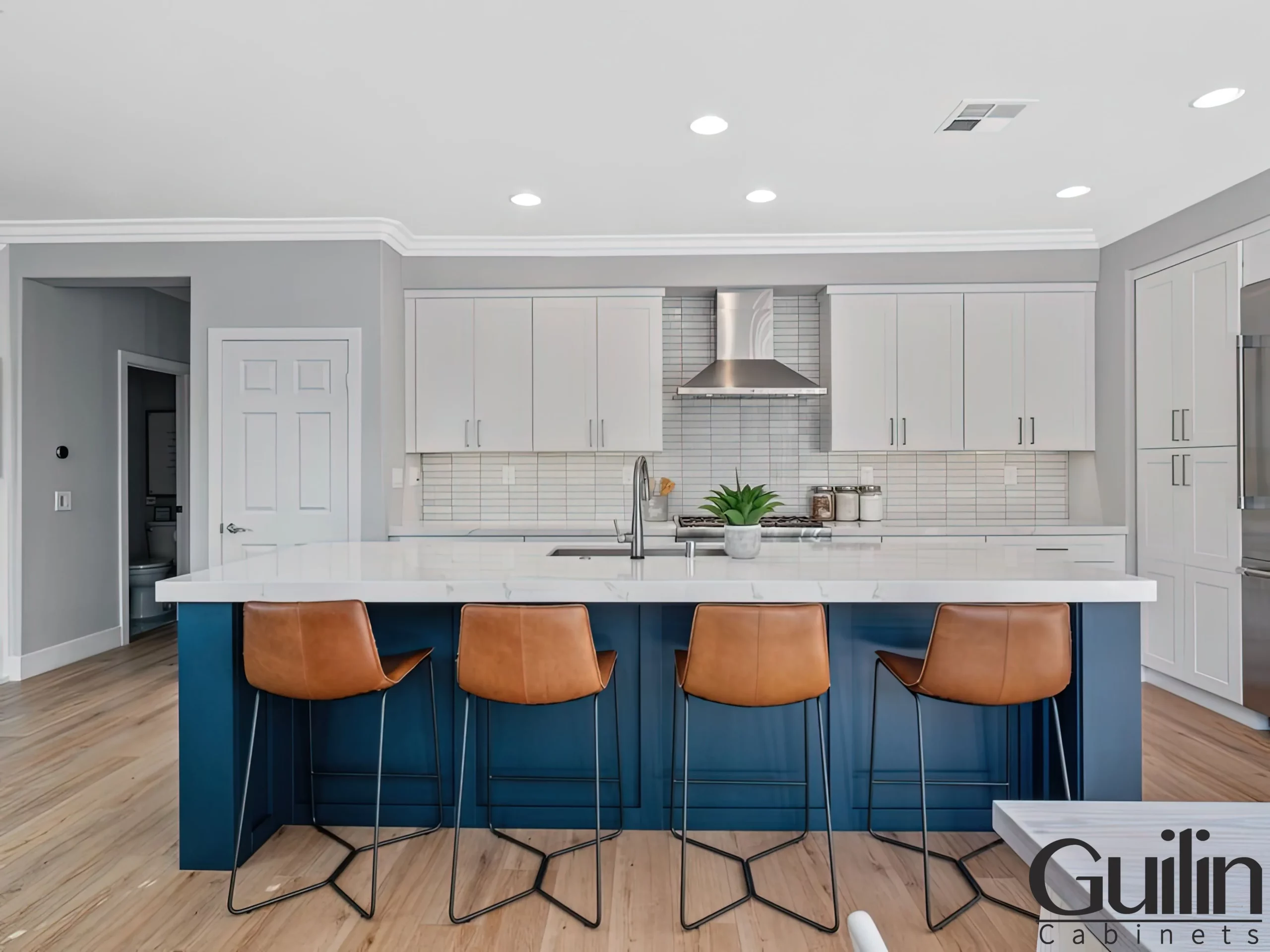 The coastal kitchen style utilizes a variety of light and natural shades, such as whites, creams, tans, and blues