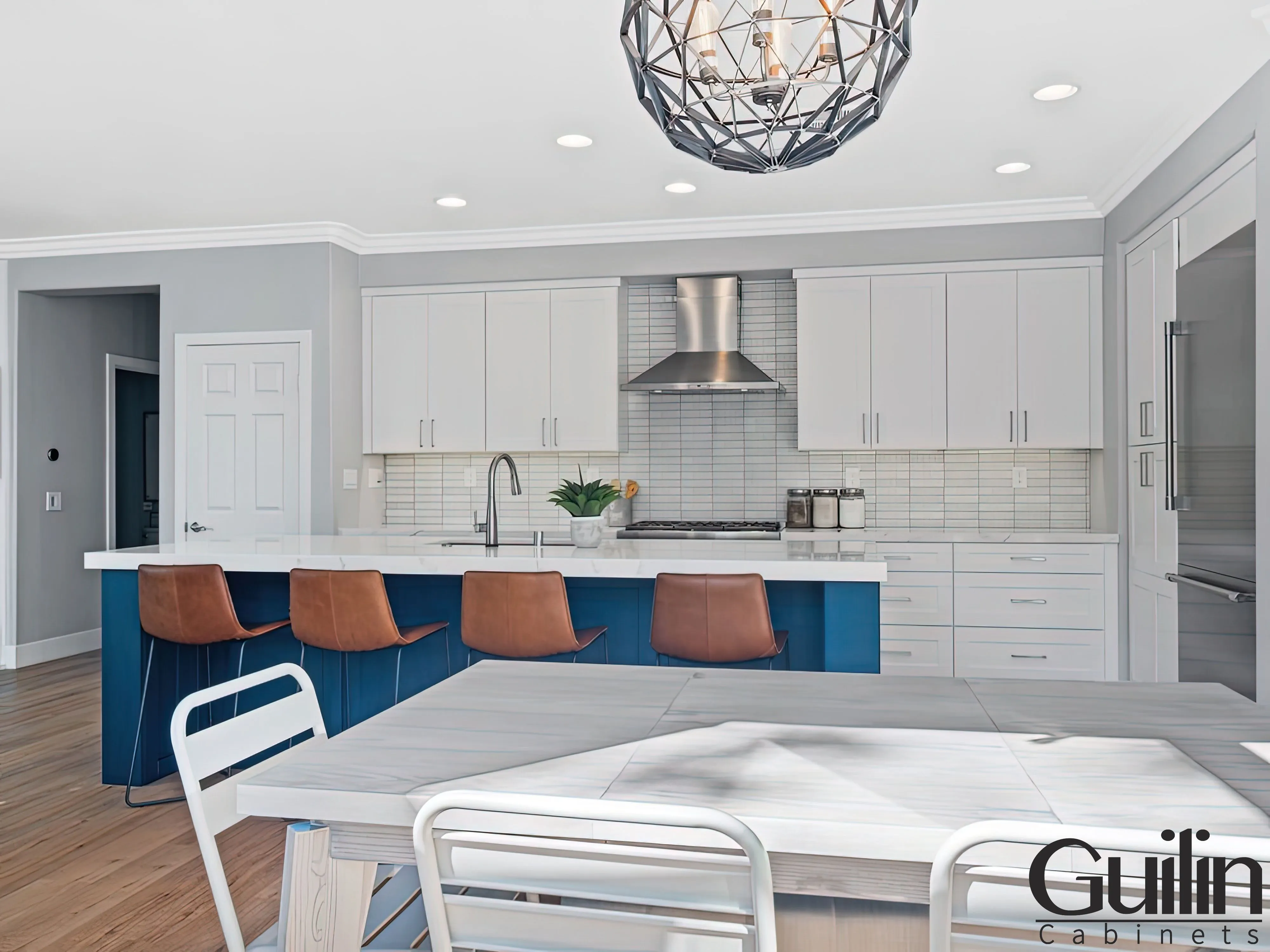 A kitchen with navy blue cabinets needs to be designed with color in mind since the proper color scheme can really make the room pop.