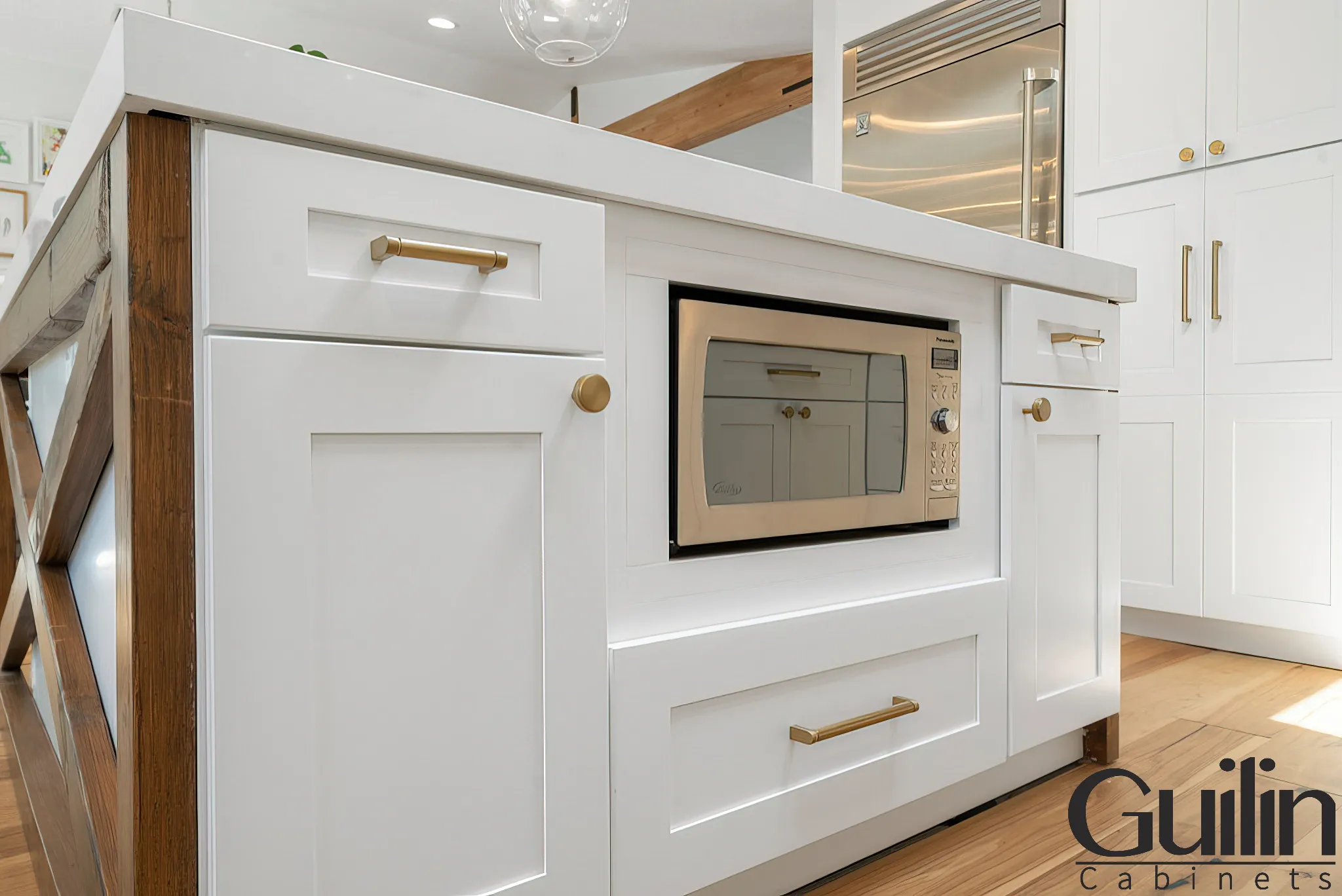 The reflective surfaces of white kitchen cabinets can make the room appear larger.