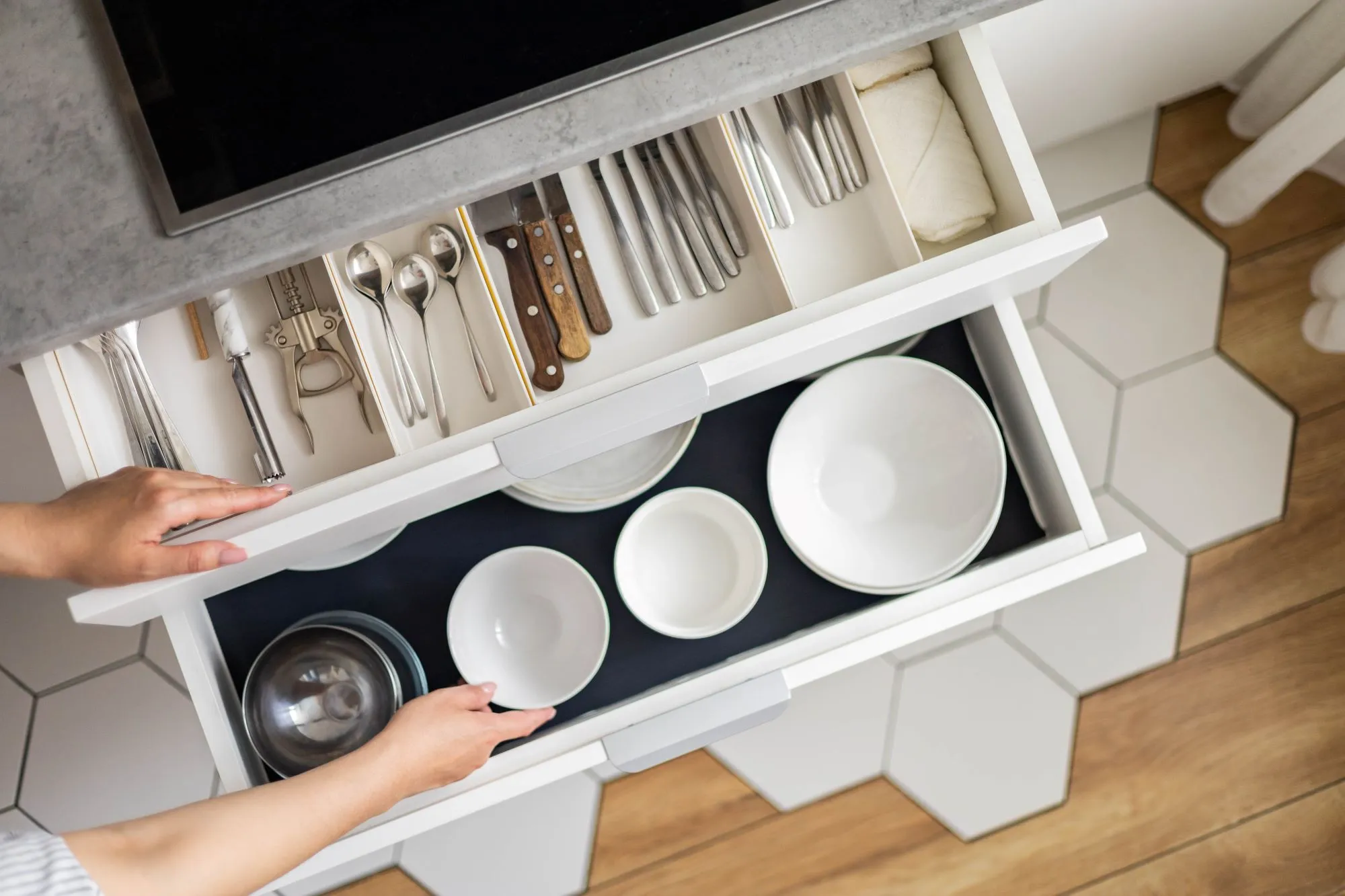 With the help of cabinet drawer dividers, you can avoid any confusion when trying to find specific kitchen items.