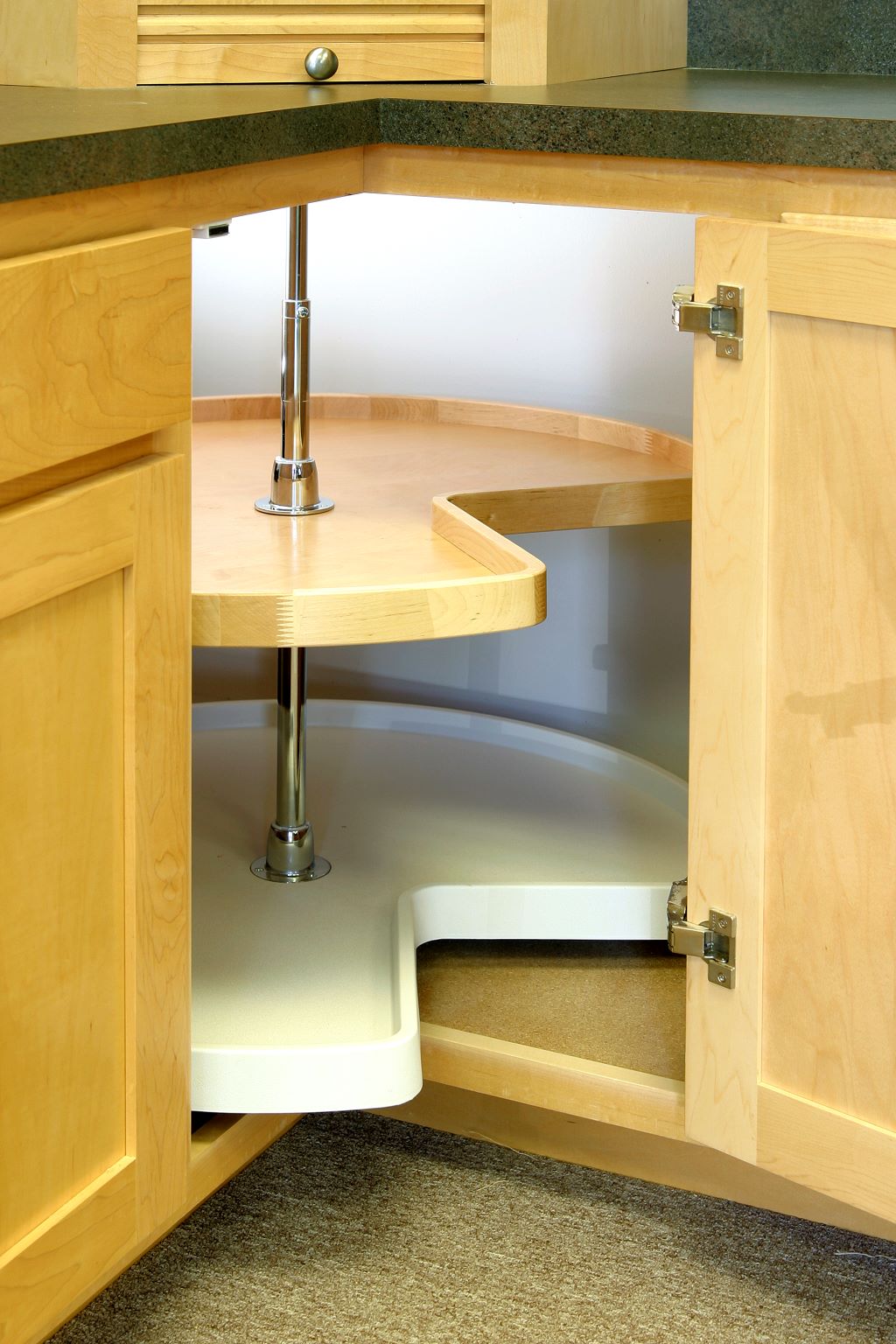 The Lazy Susan design is a popular option to consider when you want to replace your kitchen cabinets.