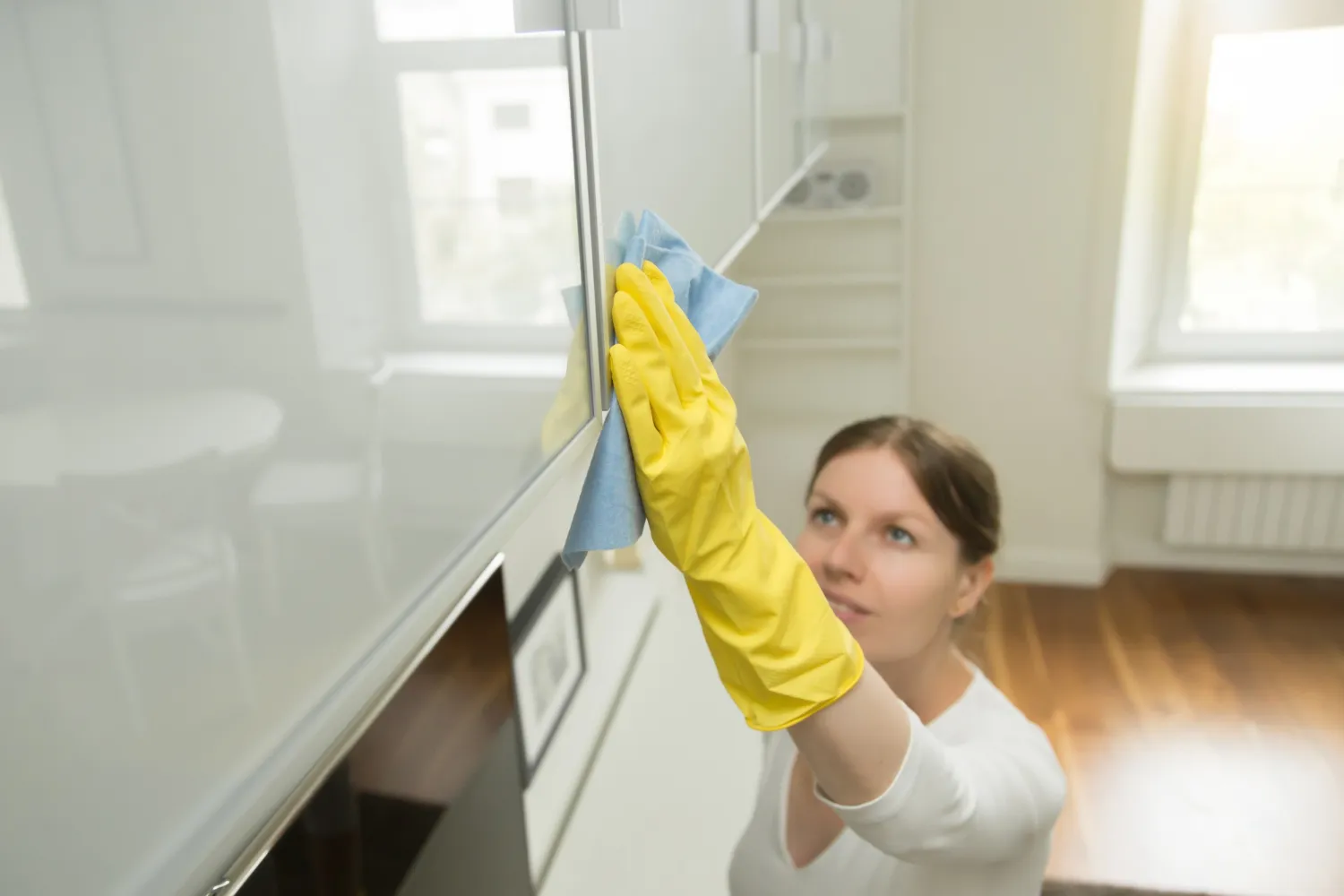 Use a soft cloth or a feather duster to gently wipe away the dust. Avoid using abrasive materials that may scratch the cabinet surface.