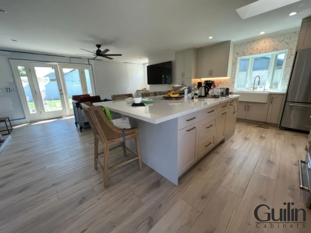 Open-Plan Living Room and Kitchen Remodel in Huntington Beach by Guilin Cabinets