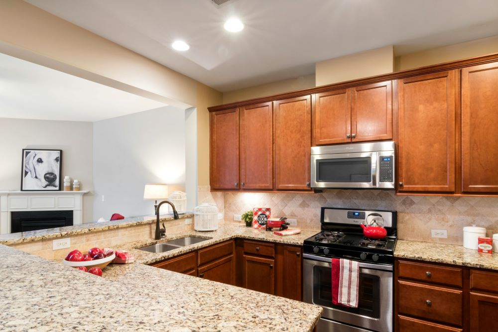 Granite can withstand high temperatures and acidic foods. Thus, granite backsplashes are unlikely to be damaged by hot pans/pots or acidic foods like tomatoes, vinegar, or coffee.