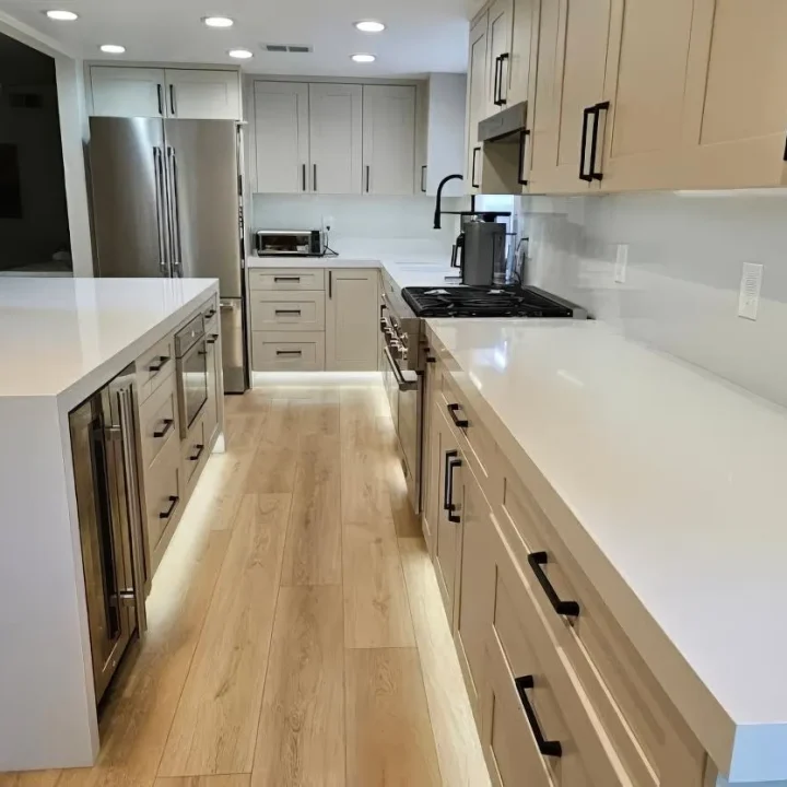 Lake Forest Sleek and Contemporary White Galley Kitchen Remodel with Quartz Countertops and Shaker Cabinets